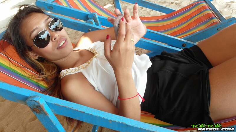 Libidinous oriental female lives stripping for man she meets on beach