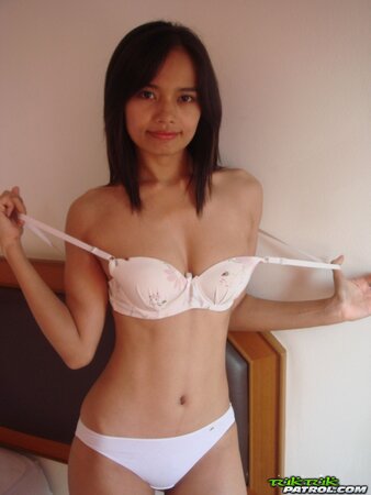 Stunning exotic teen undresses with intention to finger own cunny in bed