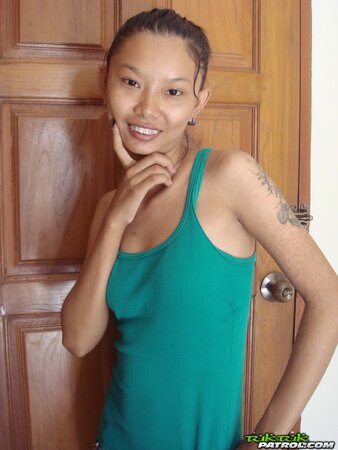 Skinny young Asian woman satisfies her sexual cravings getting naked