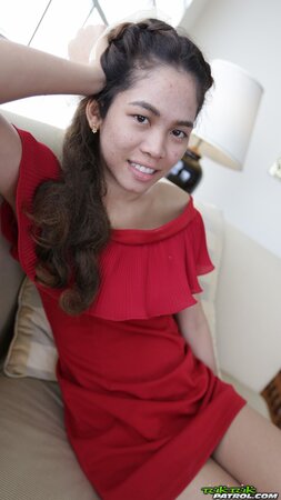 Thai slut in a red dress never stops smiling even in the backseat of a taxi