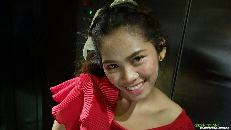 Thai slut in a red dress never stops smiling even in the backseat of a taxi