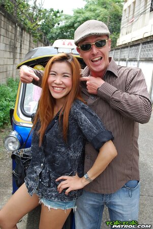Clothed Thai girl with a cute face and red hair can brag about wonderful legs
