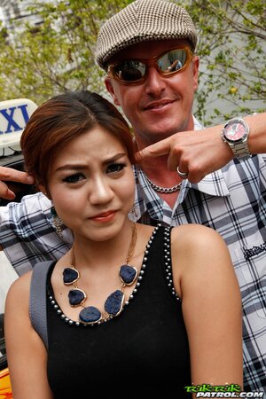 Eccentric tourist coaxes modest Asian teen to pose outdoors near rickshaw