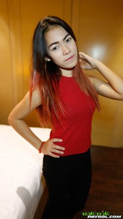 Thai babe with big expressive eyes shows off her tiny boobs and hairy pussy