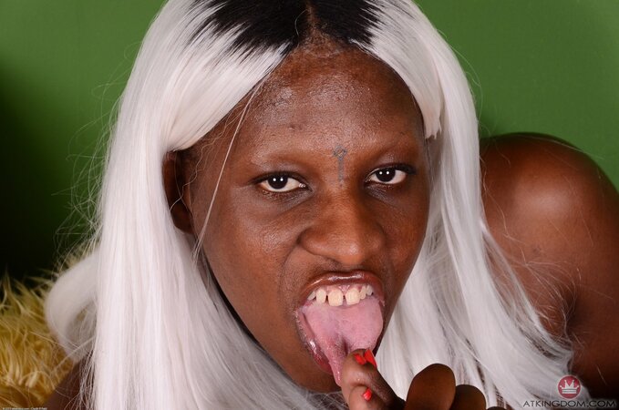 Black whore with white hair isn't shy to get naked and put hairy pussy in camera