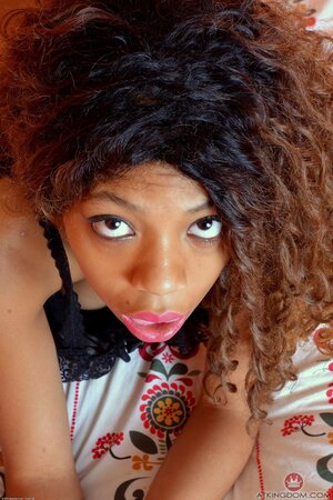 Black girl with natural tits really loves her work including posing in the nude
