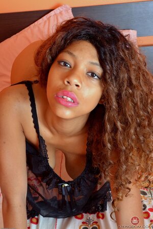 Black girl with natural tits really loves her work including posing in the nude