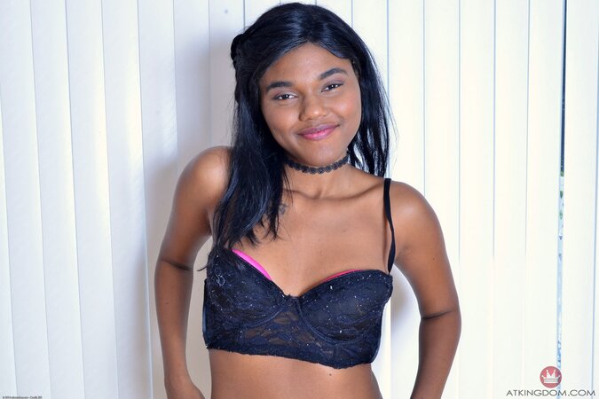 Ebony babe with smooth body allows her charms to be bared for XXX photoshoot