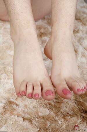 Wondrous girl takes off stockings to expose pink pedicure besides hirsute pussy