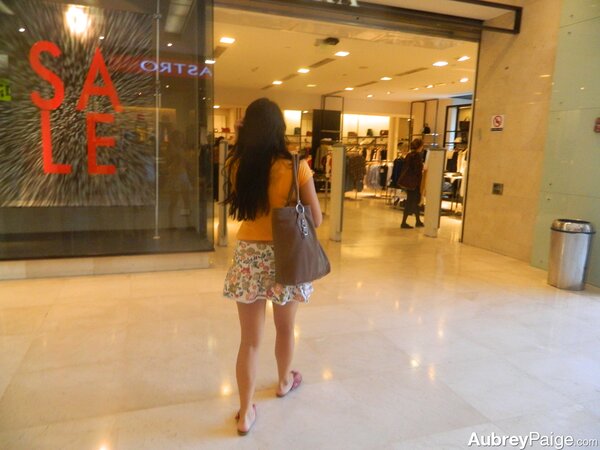 Young shopaholic acts very naughty in a fitting room located in the mall
