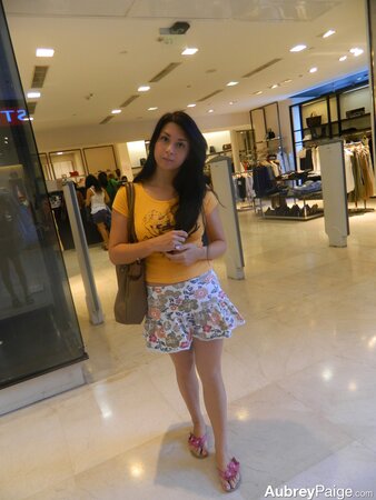 Young shopaholic acts very naughty in a fitting room located in the mall