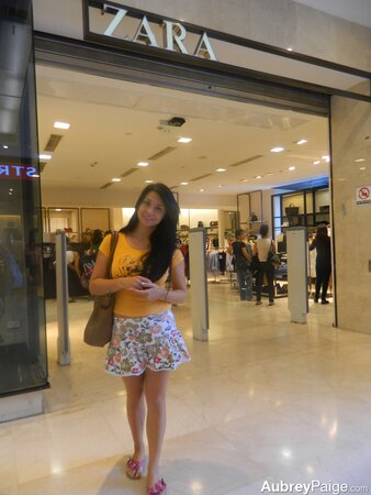 Young shopaholic acts very naughty in a fitting room located in the mall