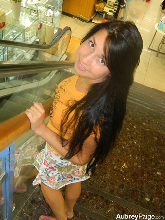 Young shopaholic acts very naughty in a fitting room located in the mall