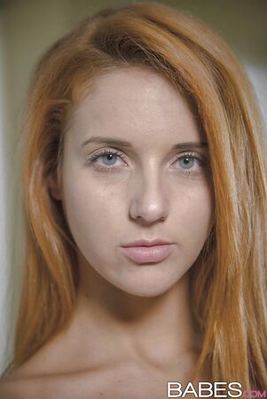 Chick with fire-red hair takes advantage of caretakers' absence to pose naked