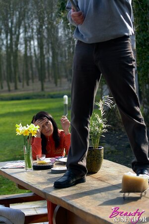 Girl in an orange overalls makes it with mustachioed homeowner outdoors
