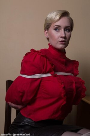 It's comfortably for model in red shirt and black skirt to be hogtied