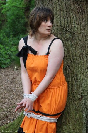 Helpless housewife is captured by lover and tied up to tree in public park