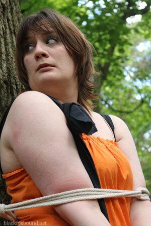 Helpless housewife is captured by lover and tied up to tree in public park