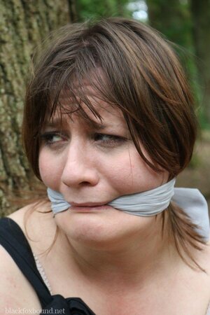 Helpless housewife is captured by lover and tied up to tree in public park
