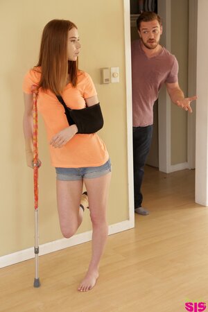 Injured redhead with a small butt has sex with her caring stepbrother