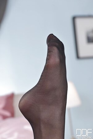 Steamy female licks her own feet with pantyhose on and without them