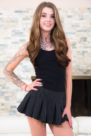 Young woman with tattoos on each body part proves she is hot in the nude