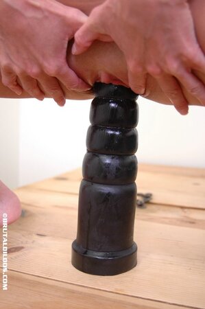 Teen with bright eyes Alissa has a huge dildo to shove it into her twat