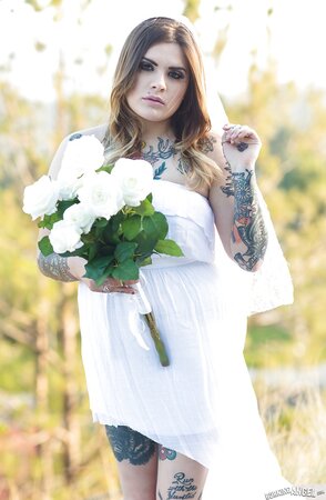 Colleen in white has a tattooed body including nipples to expose outdoors