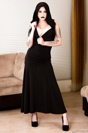 Pale-skinned brunette girl wears only black and masturbates on the floor
