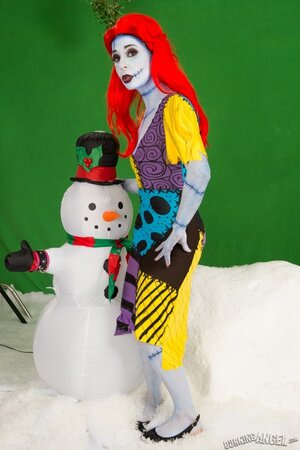 Pornstar with fiery red hair looks fuckable even when cosplaying a zombie