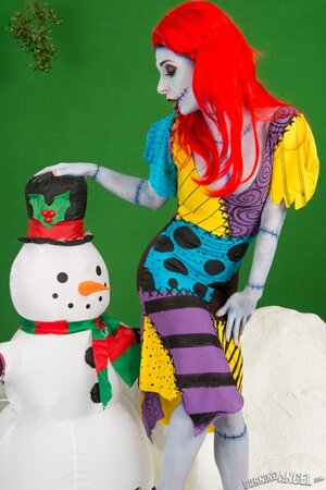 Pornstar with fiery red hair looks fuckable even when cosplaying a zombie