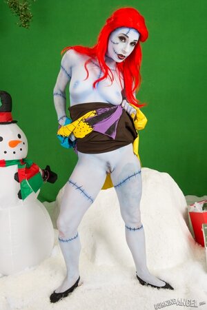 Pornstar with fiery red hair looks fuckable even when cosplaying a zombie