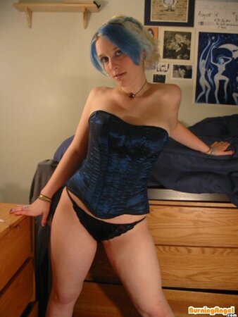 Babe with colorful hair doesn't feel shy to flash her smooth pussy
