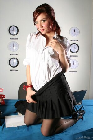 Office slut works alone so she can strip and masturbate talking on the phone