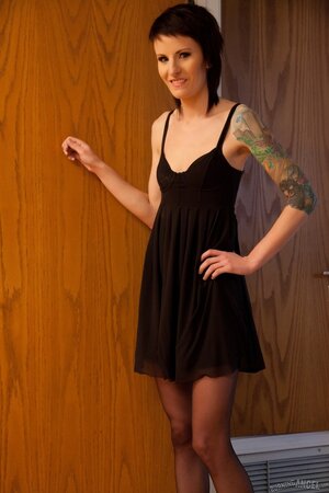 Skinny chick with a tattoo on her shoulder fools around and gets cum on flat chest