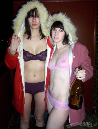 Lovely girls drink beer outdoors and this makes them eager to touch each other