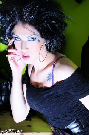 Hedonistic rock temptress with a bat unveils her cunt and fingers it