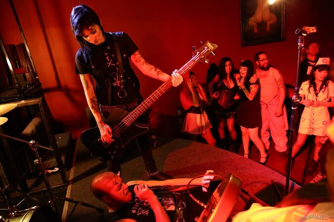 Girl is living it up at a rock concert and as singer comes closer she kisses him
