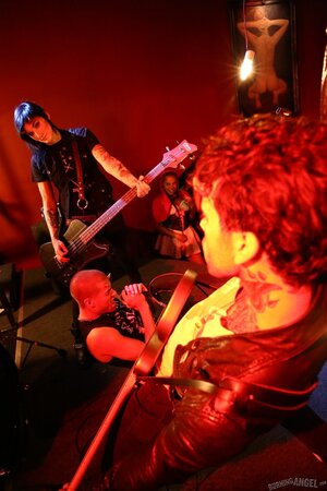 Girl is living it up at a rock concert and as singer comes closer she kisses him