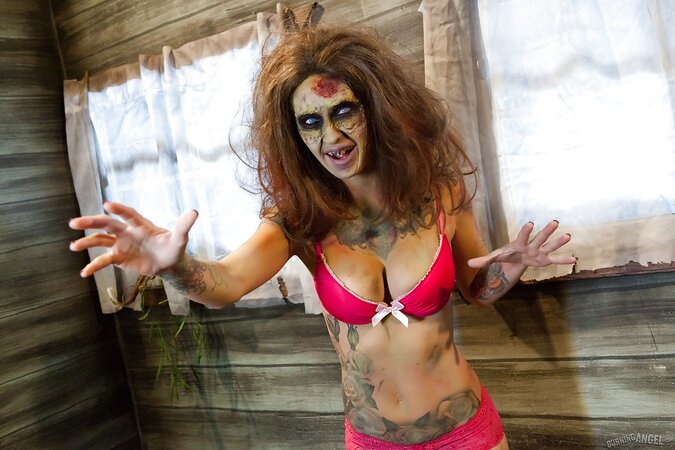 Female zombie with blue eyes and tattoos looks for a cock to satiate pussy