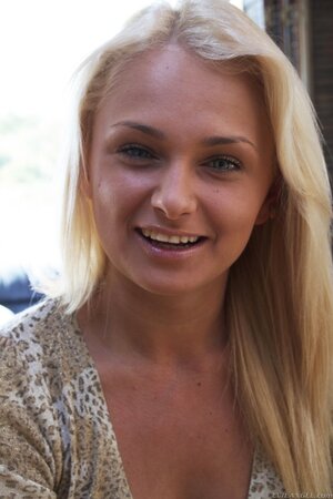 Sweet Russian girl strips to her blouse exposing small perky breasts