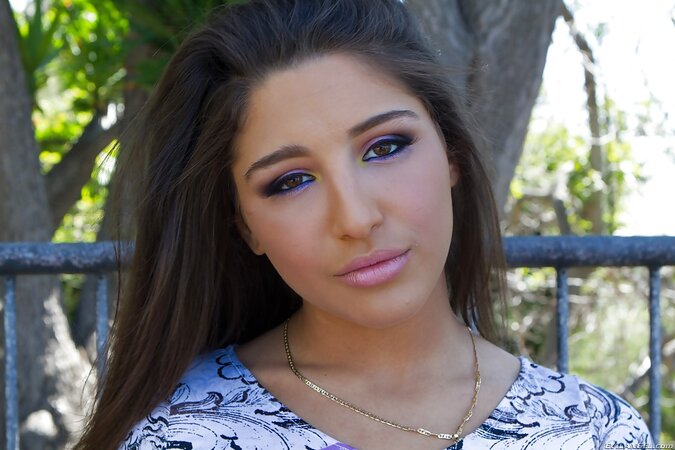 Erotic girl wears purple pants underscoring her tight bottom pulls them down