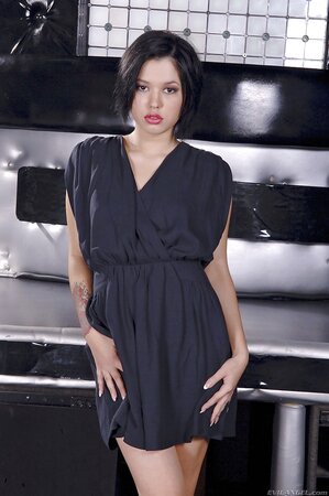 Sensual brunette gets rid of the dress and underwear remaining in shoes only