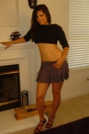 Sunny Leone improvises strip show by the fireplace when the camera turns on