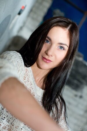 Sweet brunette finds an abandoned building perfect for a solo photoshoot
