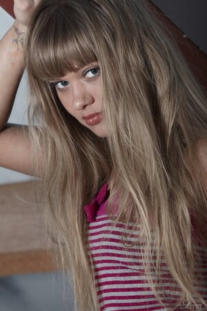 Freshly young sweetheart shows photographer bald pussy and small breasts