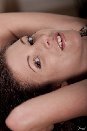 Slender gal with curly hair loves to fool around naked while being alone at home