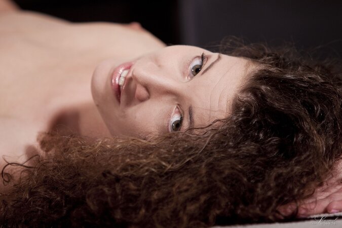 Slender gal with curly hair loves to fool around naked while being alone at home