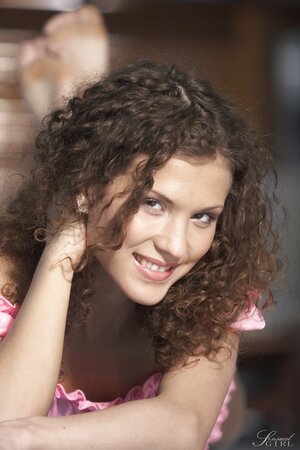 Curly-haired cutie Juliette Shyn relaxes completely naked near swimming pool