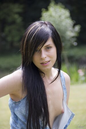 Seductive tender brunette undressing to show her awesome pussy on a swing